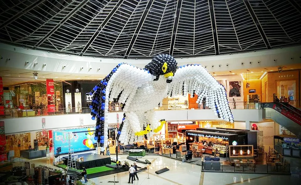 Stages of Air — Giant balloon falcon sculpture with outstretched wings in Dubai Marina Mall